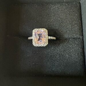 Light purple emerald cut stone with halo cz diamonds